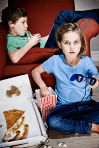 kids in the summer eating and playing video games