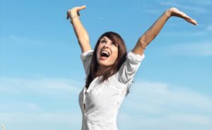 happy/productive woman with arm in the air