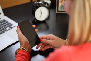 organized mom holding phone