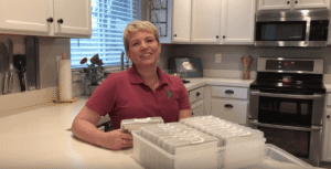 Perfectly Placed team member holding Photo organizer
