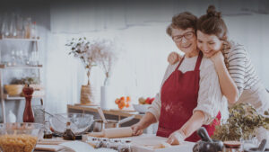 Grandmother and granddaughter in clean organized kitchen