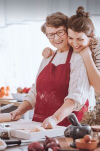 grandmother and granddaughter baking