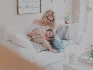 happy woman on couch with child