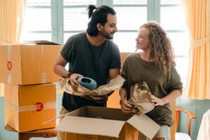 couple unpacking boxes