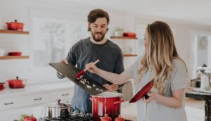 Couple cooking in kitchen
