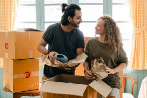 Couple packing for a move