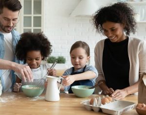 Family cooking breakfast in clean and organized kitchen