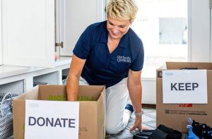 Experienced professional organizer Susan Stewart of Perfectly Placed sorting through boxes