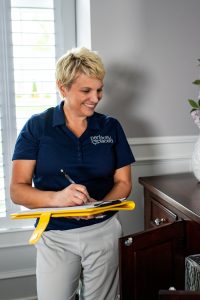 St. Louis and West County Home organization expert Susan Stewart looking at a dresser drawer